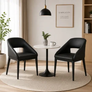 Black leather barrel back dining chairs with curved backrest in a modern dining room